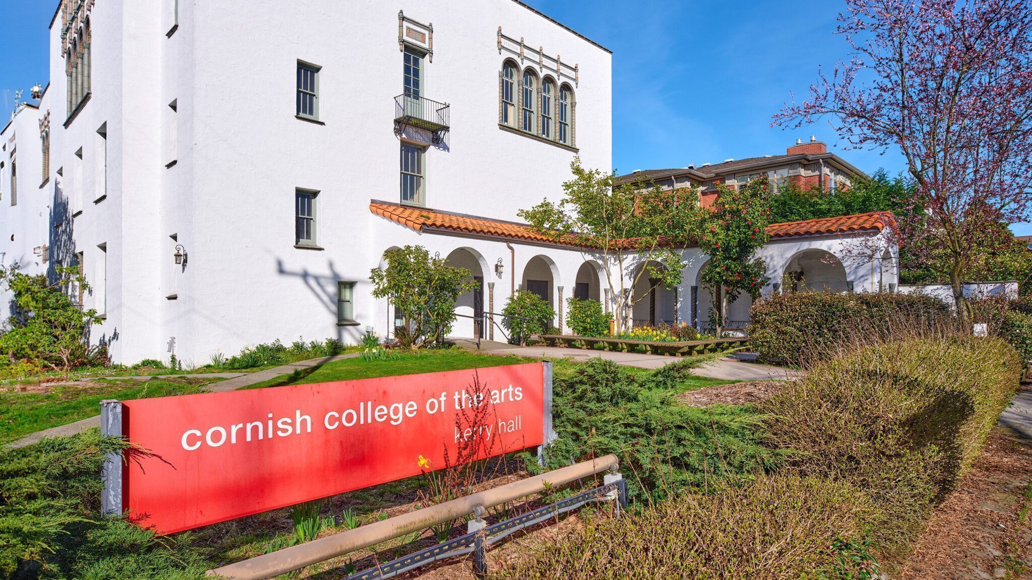 Exterior view of the historic Cornish College of the Arts' Kerry Hall on a sunny day with clear skies.