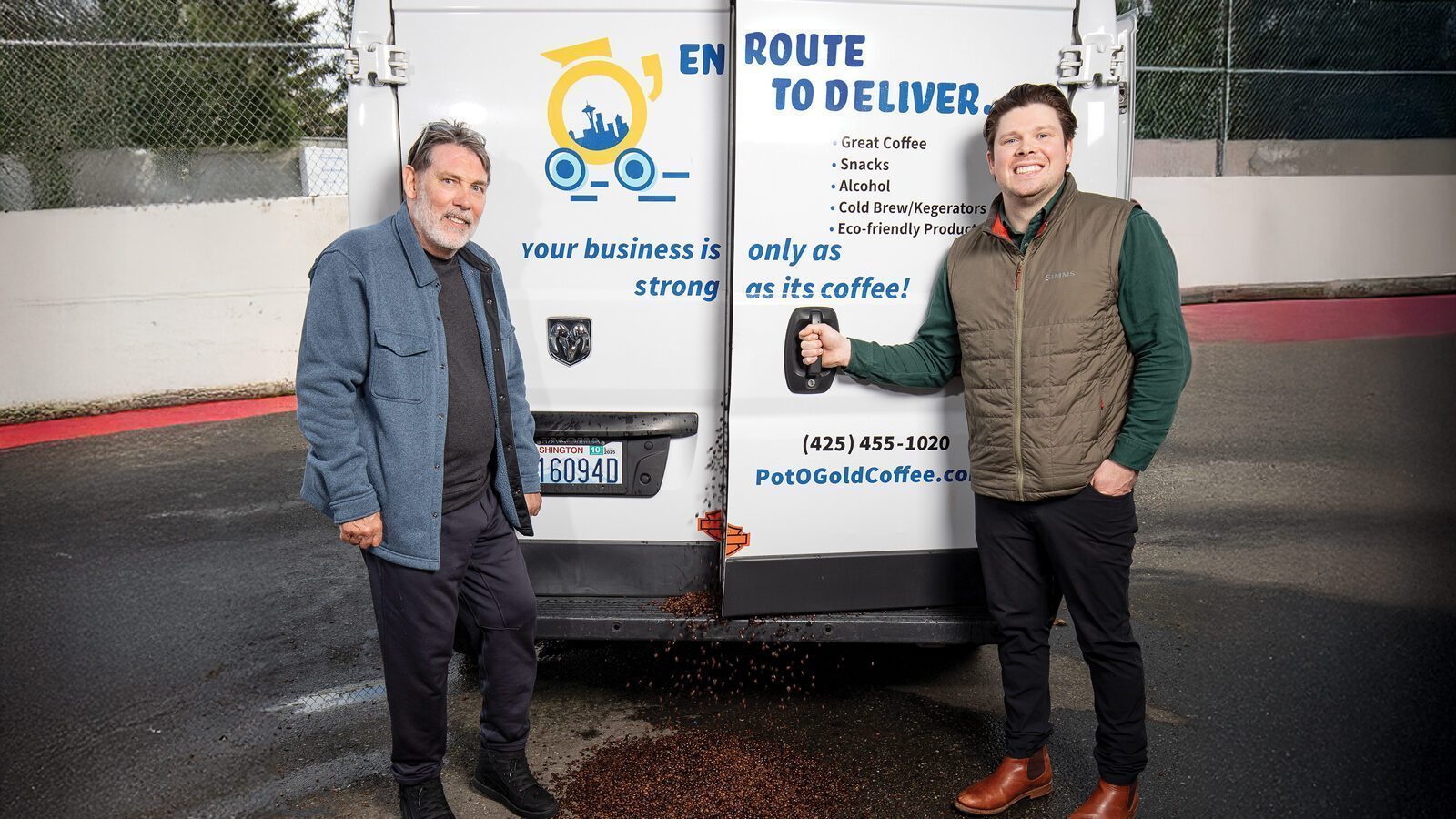 Two men stand beside a Pot O' Gold delivery van, with coffee beans spilled on the ground behind it. The van displays an office coffee company advertisement.